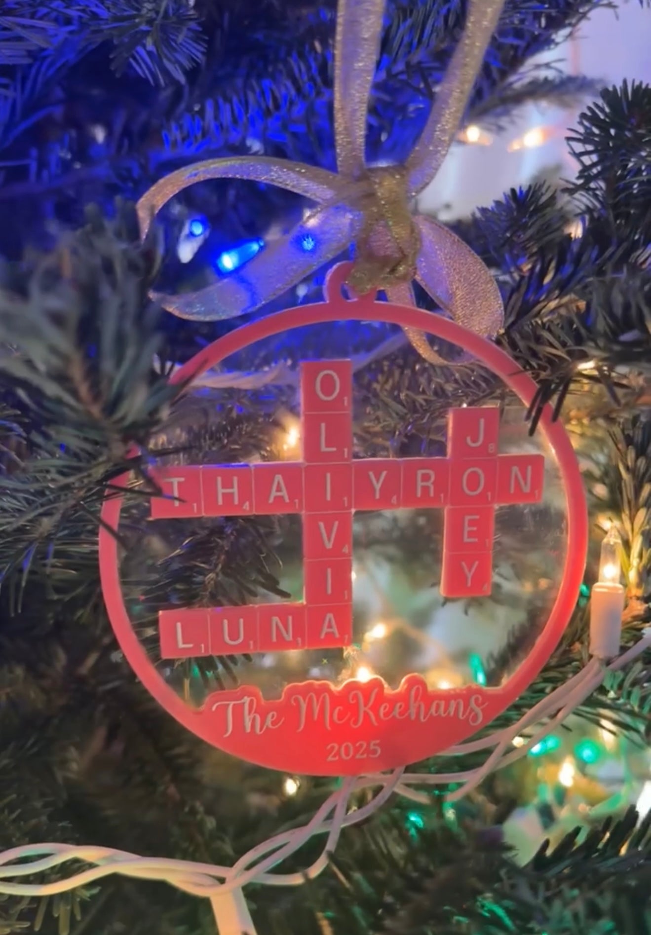 Decorative ornament with names on a Christmas tree